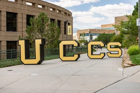 uccs letters on sidewalk